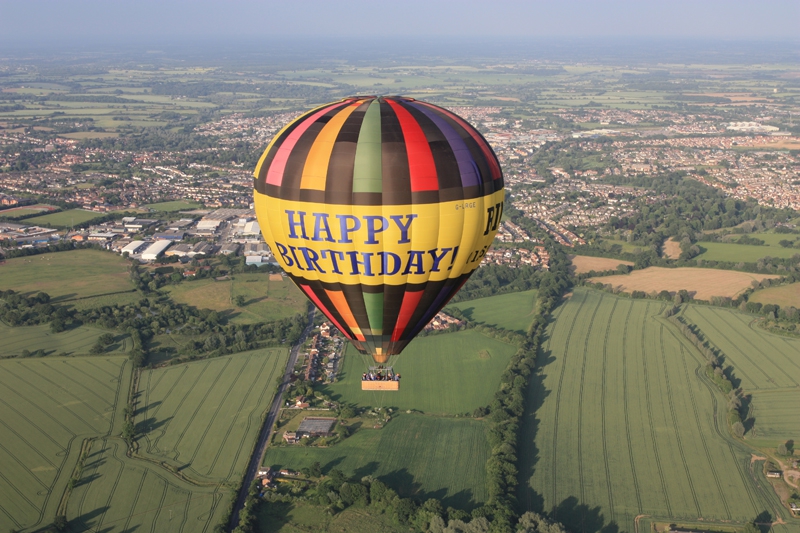 Our Happy Birthday Hot Air Balloon makes one of its flights over Essex with&nbsp;Braintree&nbsp;in the background