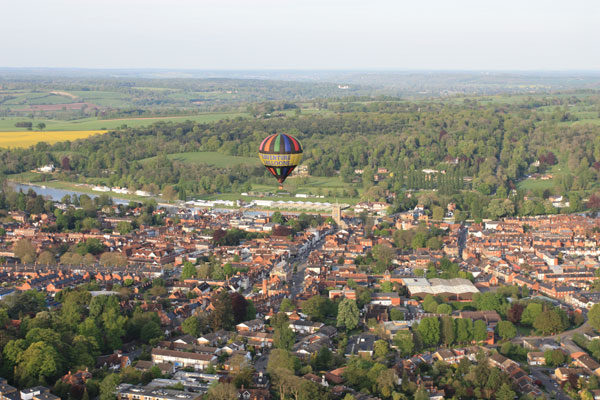 Preparations are underway for the 2014 Henley Regatta as one of our hot air balloons flies past on a spring evening