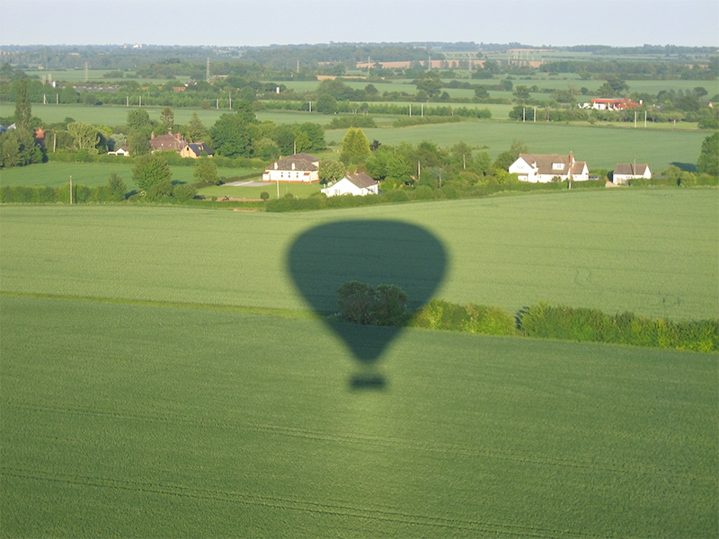 Taking pictures of the balloon shadow and the aerial view is popular on Sussex Balloon Flights and Rides
