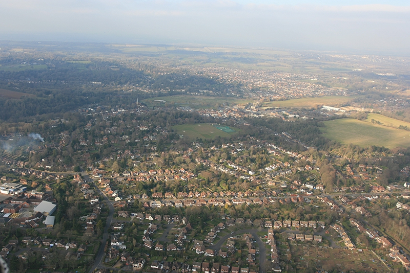 Looking back towards Godalming from the South East on the balloon flight over&nbsp;Surrey. The Wey Navigation runs along the edge of the green fields in the picture.