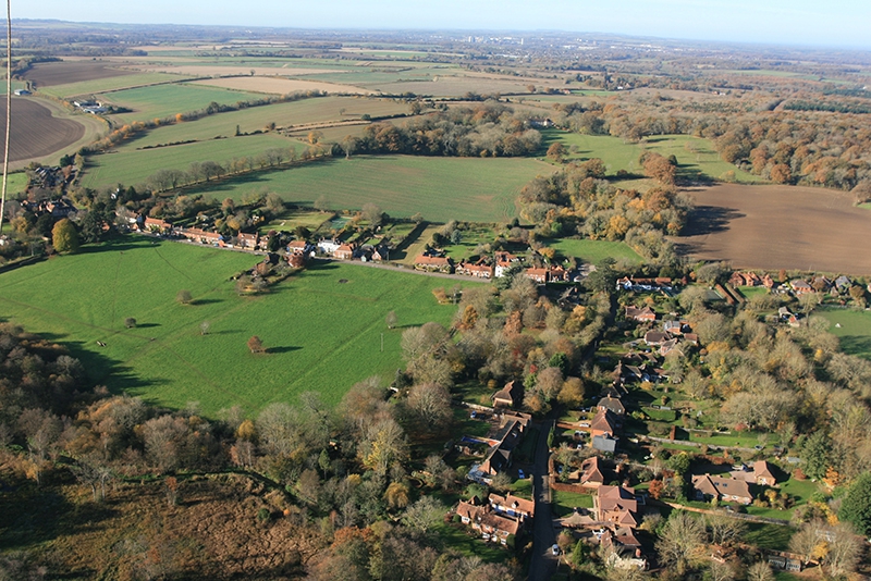 Greywell village in Hampshire view from the air with a picture taken by hot air balloon on a flight with Adventure Balloons.