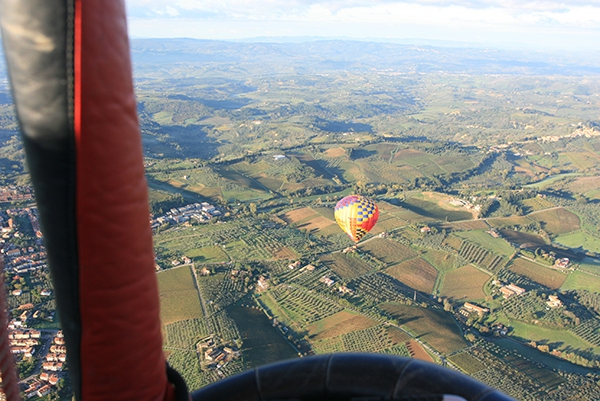 What a beautiful morning to be flying over the Tuscan countryside in Italy in a hot air balloon.