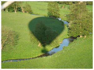 Our Lindstrand 330 hot air balloon casts a shadow over the river Wey 