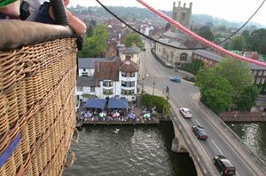 Drifting in a hot air balloon over the River Thames at Henley on Thames in Oxfordshire.