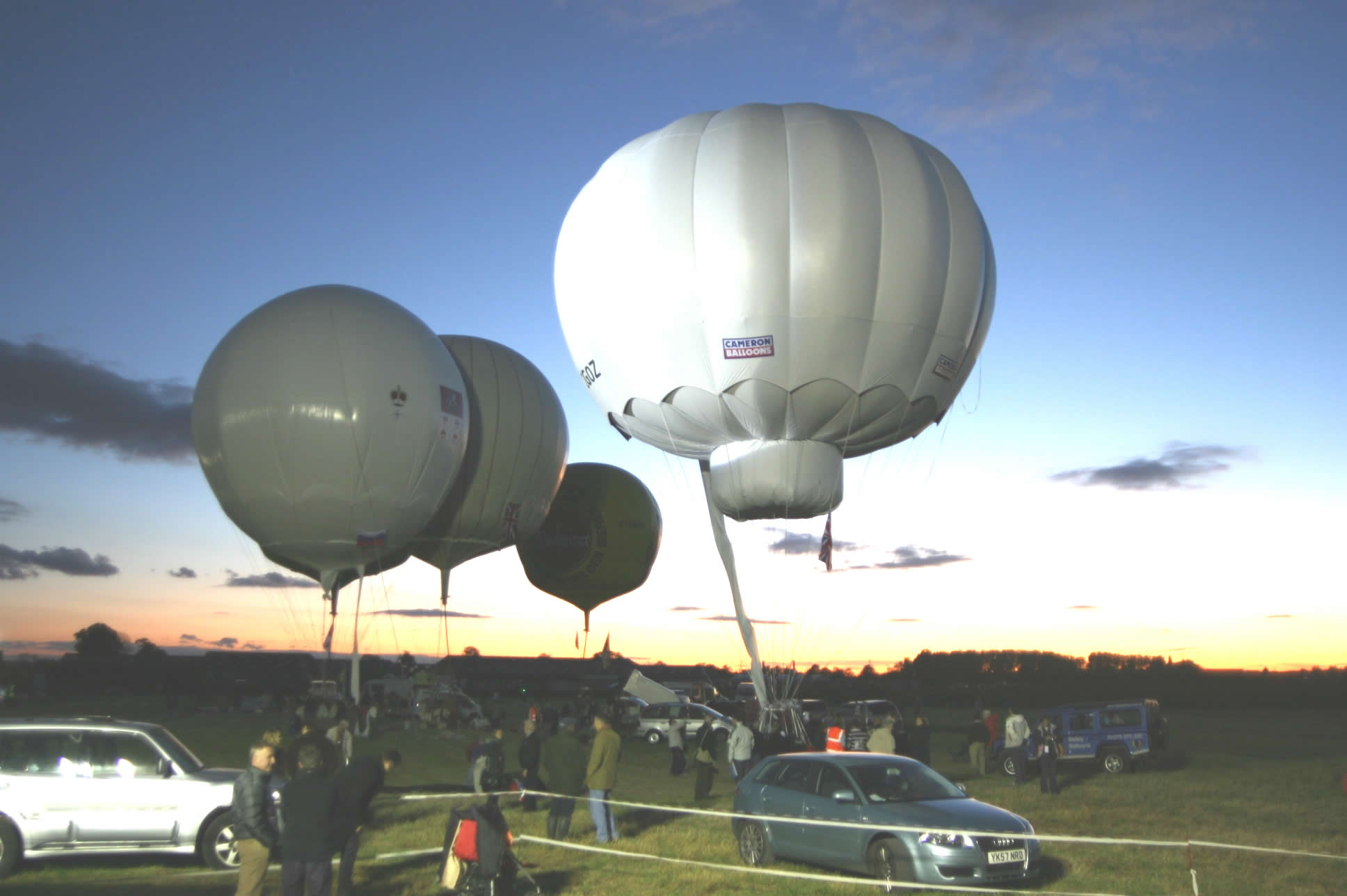 Inflated balloons at susnset as most race competitors are ready to go