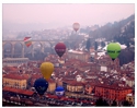 Hot air balloons flying over Mondovi market place