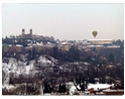 Hot air balloon flying over Mondovi old town