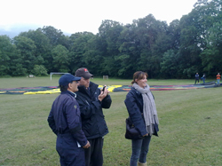 Jim Murray checks the weather radar for showers with balloon pilot Kim Hull while Sarah looks to the skies