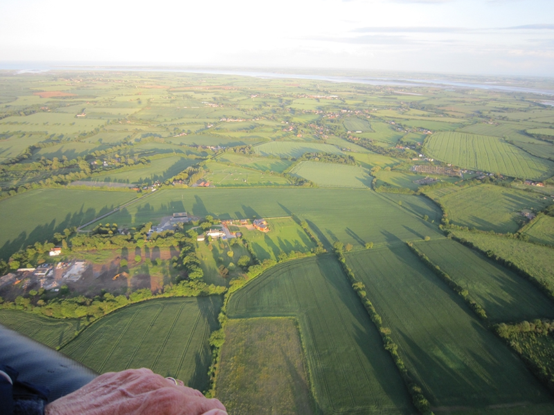 With over 350 miles of coastline and river side hot air balloon flights over Essex will capture views of the coastline from the vantage point provided in the balloon basket. This shot is looking at the Blackwater Estuary having taken off on a balloon flight from Prested Hall near the Roman town of Colchester.