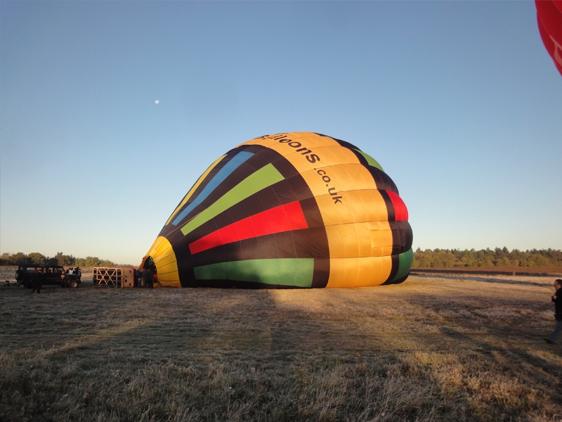 As you arrive at one of our Kent balloon flight launch sites our balloon and crew will start their preparations of the balloon for flight. The balloon basket is unloaded from the balloon trailer and you will be able to get involved in spreading out the 100 foot tall balloon out on the ground. Soon after the fans that will blow cold air into the balloon to ready it for the heat of the burners and take off.