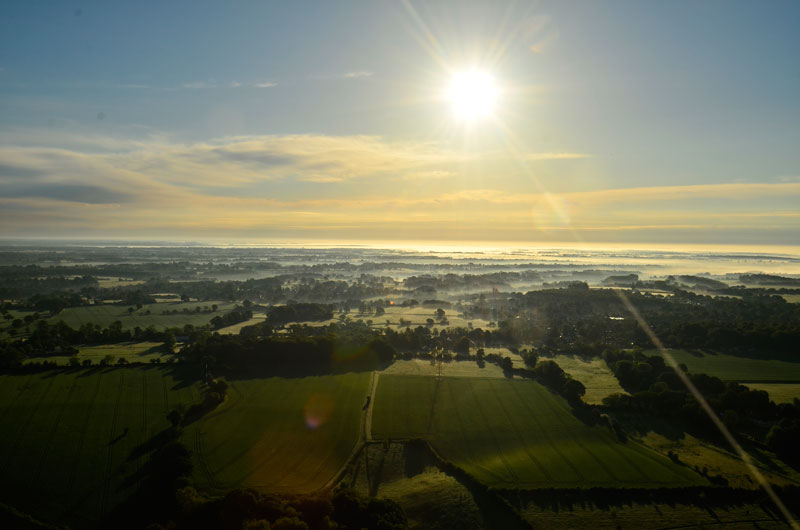 The valleys of the Chiltern countryside create ideal conditions for the formation of mist and wisps of low cloud in the early mornings. Sometimes this persists for a short while to be visible in the first minutes of a hot air balloon ride over Buckinghamshire before the suns heat burns it off