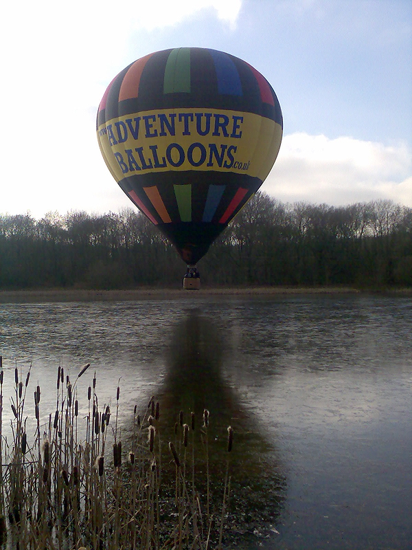 The classic picture of a hot air balloon reflection over water, shame about the ice