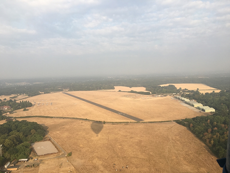 On final approach to land our balloons at Denham Aerodrome an hour and a half later after our London balloon ride.