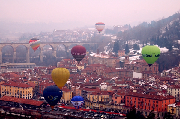 Hot air balloons flying over Mondovi market place