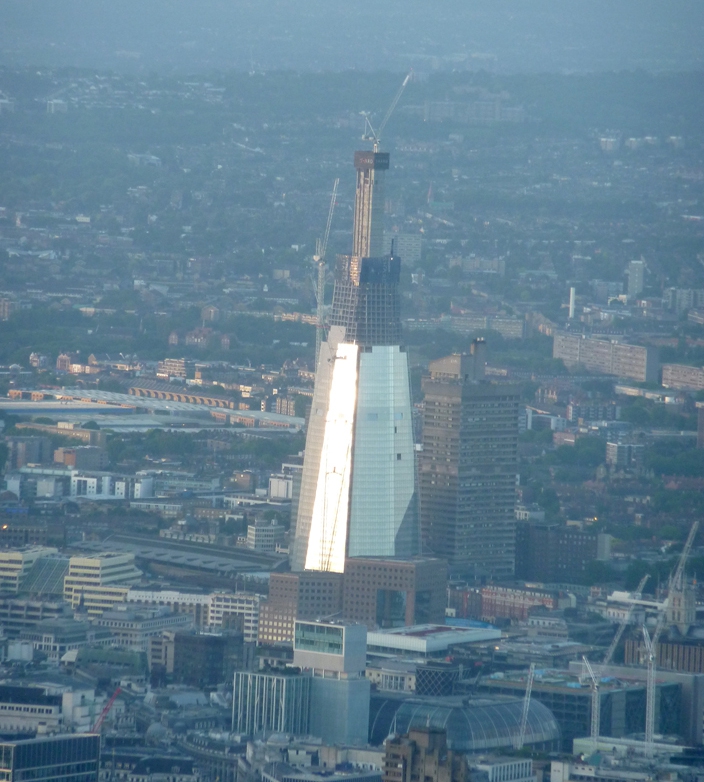 Flying past the Shard over the river Thames, London