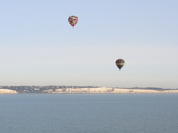 Multiple Hot Air Balloons flying over English Channel