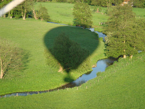 Our Lindstrand 330 hot air balloon casts a shadow over the river Wey
