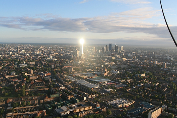 Completed and opened on 5th July 2012 we have taken nearly three years to fly on one of our London balloon flights close enough to get this stunning picture of the early morning sun reflecting on the top of the 1016 foot high, 73 floor building. This aerial view of the Shard was taken on 21st May 2015 at around 6.15am from the balloon basket by pilot Kim Hull.
