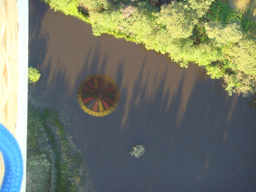 Reflection of Adventure Balloons over Black Lake near Tilford, where A A Milne was inspired to write Winnie the Pooh